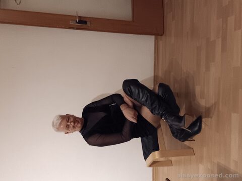 Pathetic sissy exposed in slutty black boots and sheer bodysuit. Just a disgusting loser begging to be mocked